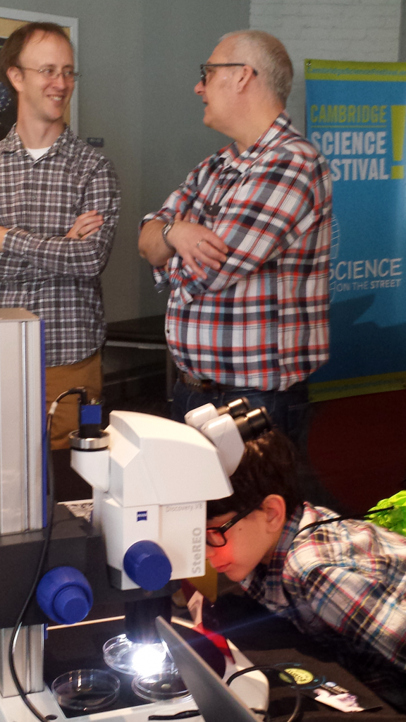 EAPS Postdoc Chris Follett and Professor Mick Follows with a young Earth Day visitor (Credit: Lauren Hinkel)