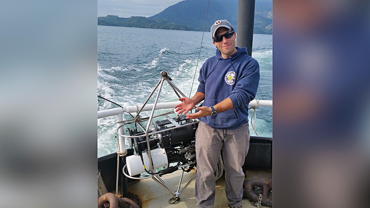 MIT-WHOI Joint Program graduate student Jamie Collins worked with WHOI scientist Benjamin Van Mooy , engineer Paul Fucile on the PHORCYS device, seen here during tests in Clayoquot Sound, British Columbia. Developed by Van Mooy and colleagues, PHORCYS measures the photosynthesis and respiration of microbes in water samples in near real-time and transmits the data to researchers. (Photo courtesy of Benjamin Van Mooy, Woods Hole Oceanographic Institution)