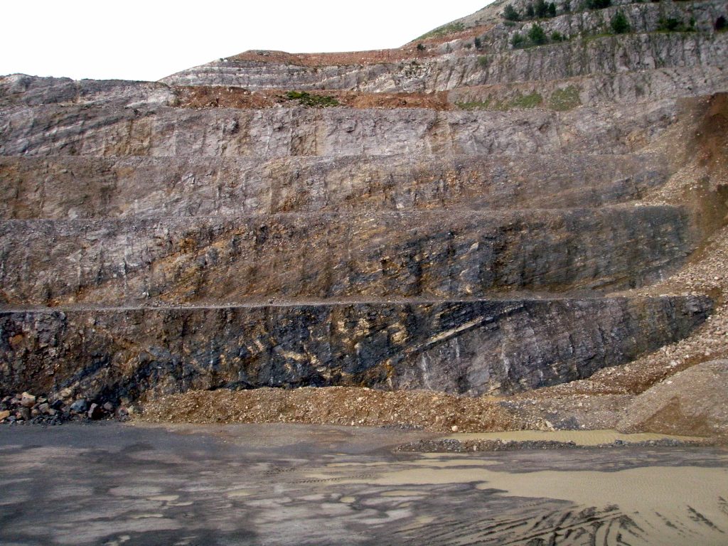The Italclementi section located in the Lombardy Basin of northern Italy. Black layers of limestone mark the transition from the Upper Triassic to the Lower Triassic. (Credit: Aviv Bachan)