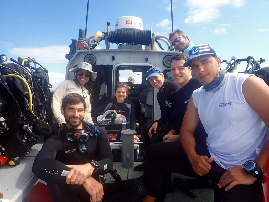 MIT-WHOI Joint Program students Laura Weber and Tyler Tamasi with Cuban scientists. (Photo: courtesy of Tyler Tamasi)