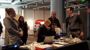 Chris Hill and Ed Doddridge explain phytoplankton interactions in Charles River water. (Photo: Courtesy of Jonathan Lauderdale)