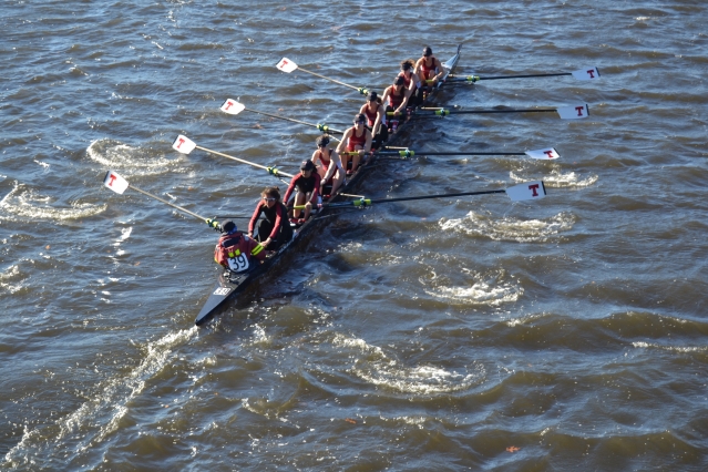 To the cheers of teammates and family on the Weeks Footbridge, the Varsity 8 row by in synch, steadily gaining on Princeton University at the Head of the Charles Regatta. Along with a four-rower boat in lightweight women’s crew, the MIT rowers are about to make program history. Left to right: Chloe Thacker (coxswain), Priya Veeraraghavan (captain), Sharon Wu (captain), Elizabeth Martin, Annika Rollock, Valerie Hunter, Michelle Lauer, Kelly Barton, and Sylvia Sarnik (Photo: Sam Hunter Magee/Arts at MIT)